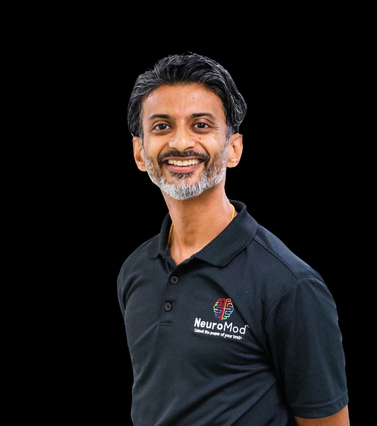 Dr. George Samuel, DC, clinical director of NeuroMod, in a black NeuroMod polo